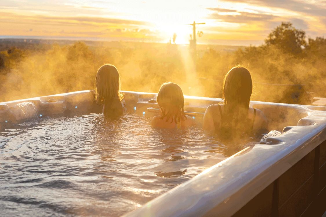 Hot tubs in the sunset scene. 
