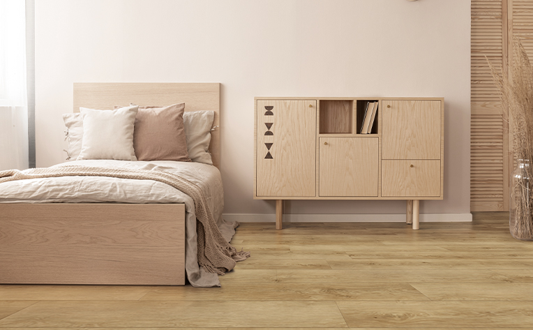 light toned luxury vinyl flooring in bedroom